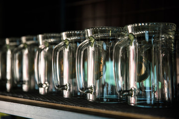 Glass of beer on a pub with bokeh background