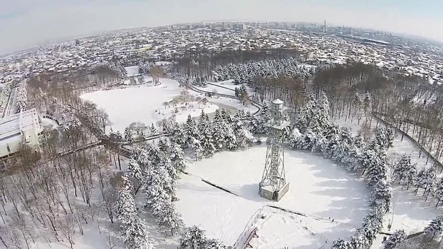 Winter scenery with former skydiving tower used for military training of troops , aerial view