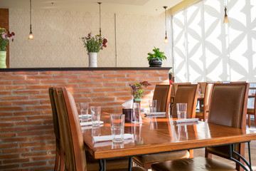 wooden dining Table and chairs in restaurant