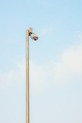 Outdoor surveillance camera on top of a pole. It has security 360 degrees view.