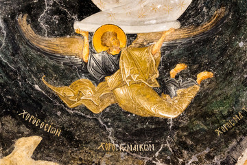 Angel flying in the black sky, an old byzantine wall-painting © Stig Alenas