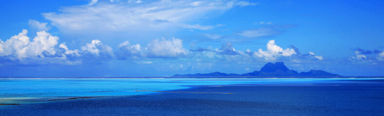 Panoramic view of Bora Bora island in Tahiti from off the coast of Taha'a.