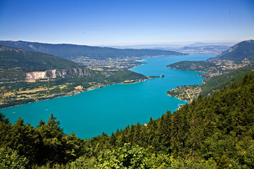 Fototapeta na wymiar View over Lac Annecy. Town of Annecy at the top. Town of Talloires is at the middle, right side.