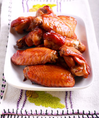 Flying chicken wings on plate