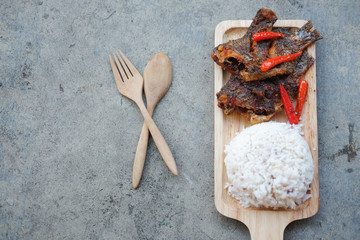 fried Tilapia fish with spicy topping