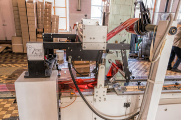Packing tape is wound around a bobbin. Automatic production line of fruit ice and ice cream