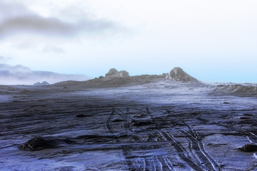 Lifeless winter night landscape. Fog over the mountains