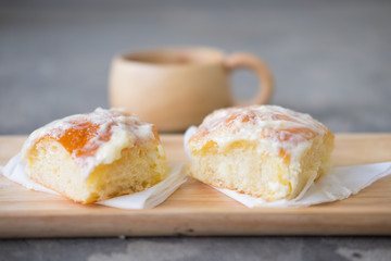 Fresh bread with icing, butter and sugar