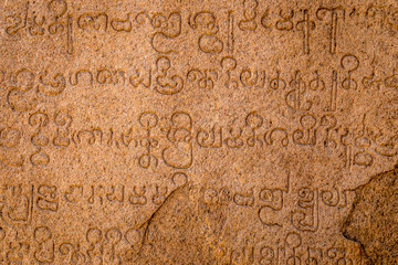 Ancient carved scripture in sinhalese language on a rock at Mamallapuram, Tamil Nadu, India