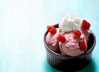 Strawberries and ice cream in a bowl