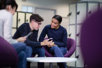 Students at college looking at smartphone
