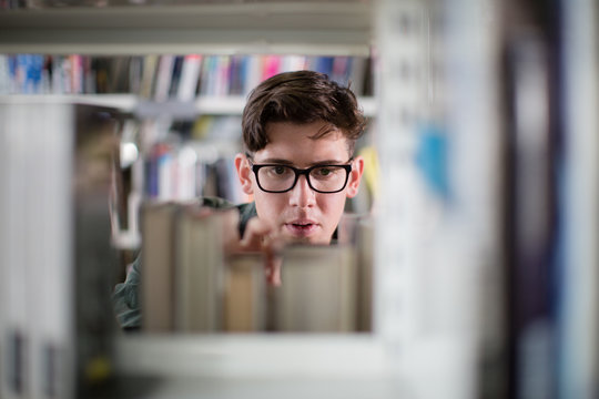 Student looking for a book in library