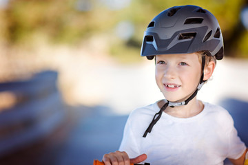 Fototapeta na wymiar kid biking in helmet