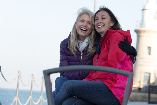 Mature Female Friends Enjoying The Outdoors In Winter