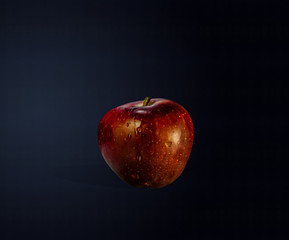 Apple isolated on dark blue background