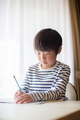boy studying or doing home work