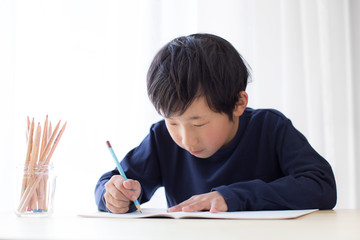 boy studying or doing home work