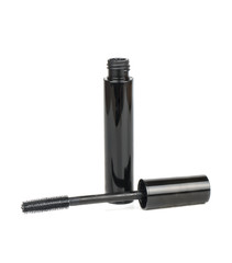 Beautiful black cosmetic mascara on white background