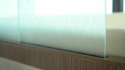 Detail of sliding door closing between kitchen and living room on a luxury yacht.