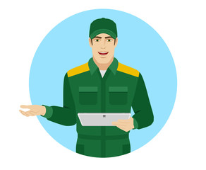 Worker holding digital tablet PC and gesturing