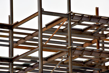 Multi-story steel frame commercial building under construction.