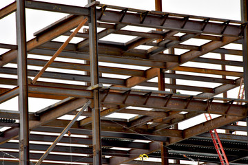 Multi-story steel frame commercial building under construction.