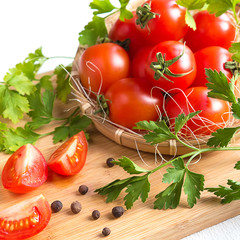 Fresh vegetables tomato, pepper, greens close-up on a light background