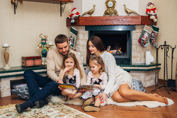 Extended Family Relaxing Together at the fireplace