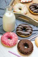 Colorful donuts with chocolate and icing, selective focus