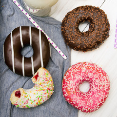 Colorful donuts with chocolate and icing, selective focus
