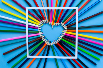 Abstract blur background. Crayon heart - Heart shape made of colored pencils