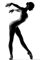 Young beautiful ballerina posing in studio