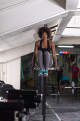 black woman doing parallel bars Exercise