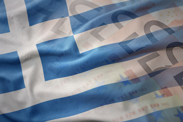 Fototapeta na wymiar colorful waving national flag of greece on a euro money banknotes background. finance concept