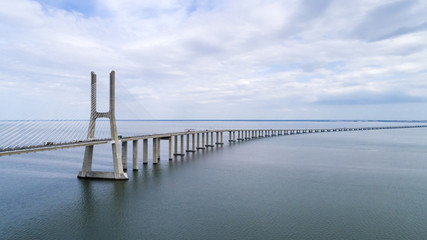 Fototapeta premium Aerial view of the Vasco da Gama Bridge over the Tagus River in Lisbon, Portugal
