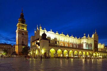 Fototapeta na wymiar Town Hall Tower and Cloth Hall (Sukiennice) in Main Market Square (Rynek Glowny) in Krakow by Night, Poland, Europe.