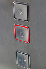 elevator buttons metal grey background