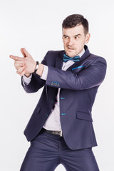 businessman making gun gesture, looking at camera. image isolated over white background. people, female, business e and portrait concept