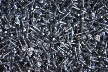 large number of screws with washer on them