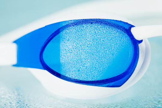 part of swimming glasses, blue background