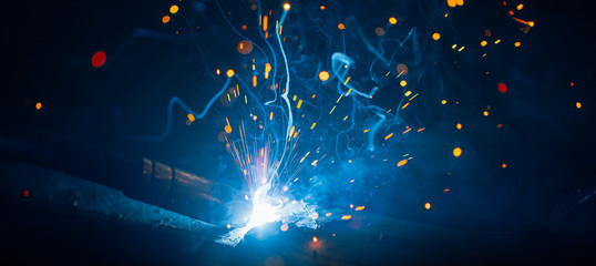 artistic welding sparks light, industrial background