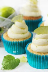 Homemade Key lime cupcakes with cream cheese lime zest frosting, selective focus