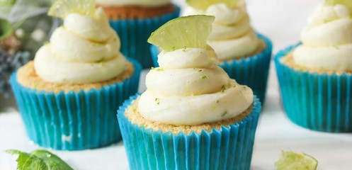 Homemade Key lime cupcakes with cream cheese lime zest frosting, selective focus