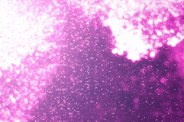 Obraz premium Magic festive pink or serenity background. Bokeh light and sparkles. Abstract glitter lights