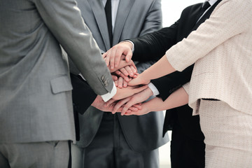 success concept collaboration: a friendly business team put thei
