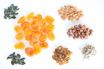 Delicacies, different spices scattered on the white background.