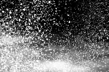 Falling realistic snow isolated on black background - design element