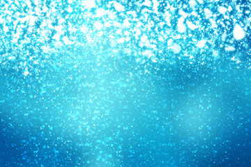 Fototapeta na wymiar Abstract round silver bokeh or glitter lights on blue background. Circles defocused particles and rays