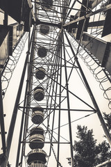Monochrome photo of ferris wheel in the old amusement park