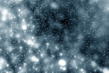 Snowflakes particles and bokeh or glitter lights on silver background. Christmas abstract template